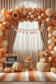 a room with balloons, pumpkins and other decorations