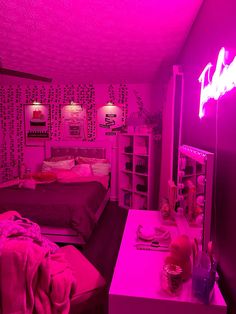 a room with two beds and pink lighting