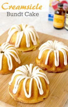 four bundt cakes with icing on a cutting board