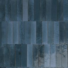 an image of a tile wall that looks like it is made out of blue tiles