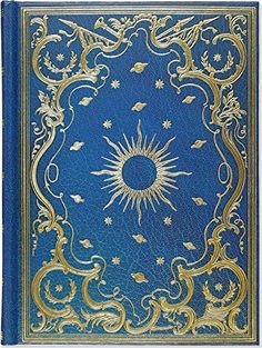 an ornate blue book with gold trimming