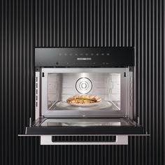 a microwave oven with food cooking in it's door and light coming from inside