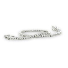 Indulge in timeless elegance with our 2cttw Diamond Tennis Bracelet. Crafted in 14k white gold, this bracelet sparkles with 81 round diamonds, I color and SI1 clarity. Measuring 2.21mm wide and 7" long, it features a box closure with two figure 8 safety clasps. Elevate any look with this luxurious piece. 14k white gold81 round diamonds, I color, SI1 clarity, 2.00ctwmeasures 2.21mm widebox closure with two figure 8 safety claspsmeasures 7" longClosure:SlideColor:White.Main Stone:DiamondMain Stone Classic Luxury Diamond White Bracelet, Luxury Everyday Diamond White Tennis Bracelet, Luxury Diamond White Platinum Tennis Bracelet, Luxury Single Diamond Bracelet In Diamond White, Luxury Classic Diamond White Diamond Bracelet, Luxury Diamond White Diamante Bracelet, Luxury White Diamond Bracelet In Sterling Silver, Luxury Round Diamond White Diamond Bracelet, Luxury Diamond White Sterling Silver Bracelet For Women