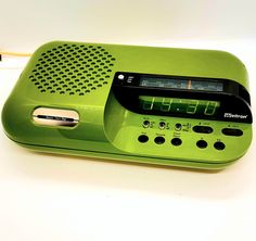 an alarm clock radio sitting on top of a table