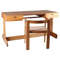 a wooden desk with a chair underneath it and one drawer on the top shelf below