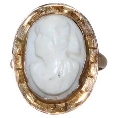 10 KT yellow gold cameo ring with unique designing. This ring is sized as 5 1/4 which could be resized if needed and is weighted 3.0 grams. The ring is hallmarked 10 K gold and has also been checked for authenticity. Cameo 14k Gold Ring, 14k Gold Cameo Ring, Yellow Gold Cameo Ring Fine Jewelry, Cameo 14k Gold Rings For Collectors, 14k Gold Cameo Ring Fine Jewelry, 14k Gold Cameo Rings For Collectors, Collectible 14k Gold Cameo Rings, Classic Cameo Yellow Gold Rings, Oval Cameo Yellow Gold Ring