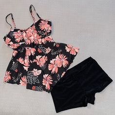 New Tankini/Shorts Black Floral Swimsuit Flattering Handkerchief Layers On Front Of Tankini Peach And White Floral Print Black Shorts Adjustable Straps Removable Pads Size M Perfect Condition No Tags But New, Never Worn #5510 Black Tankini With Built-in Shorts, Black Short Tankini For Beach, Black Short Swimwear For Spring, Black Short Length Tankini For Summer, Black Short-length Tankini For Summer, Black Summer Tankini With Built-in Shorts, Black Tankini With Built-in Shorts For Summer, Black Printed Swim Dress For Summer, Fitted Short Tankini For Vacation