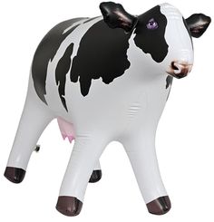 an inflatable cow is standing on its hind legs