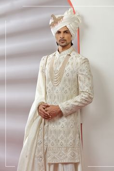 Top Details Color- Off White, Fabric - Soft Blended Silk With Embroidered Bottom Details Color- white, Fabric - Dhupion Silk, Style - free size churidar Package Include :INCLUDES 1 SHERWANI,1 KURTA,1 CHUDIDAR AND 1 STOLE Turban ,Mojari And Other Accessories Are Not Sold Along With The Dress. CARE: DRY CLEAN ONLY Additional Information : - As This Sherwani/Waistcoat/Kurta Are Made As Per Orders So It Is Strictly Not Acceptable Once Get Delivered .So Kindly Choose Body Fit Size . Also We Keep 2 In White Traditional Wear With Pearl Embroidery And Long Sleeves, White Traditional Long Sleeve Wear With Pearl Embroidery, Traditional Formal Sherwani With Pearl Embroidery, Bollywood Style Sherwani With Pearl Embroidery For Wedding, Bollywood Style Wedding Sherwani With Pearl Embroidery, White Kurta With Pearl Embroidery For Reception, Bollywood Sherwani With Pearl Embroidery For Reception, White Traditional Wear With Pearl Embroidery For Diwali, Festive Wedding Kurta With Pearl Embroidery