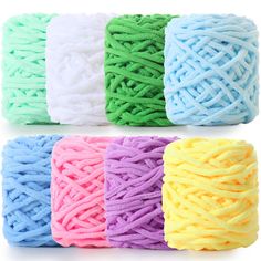 several colors of yarn on white background