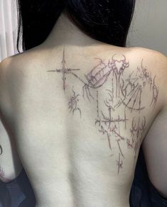 the back of a woman's shoulder with writing on it