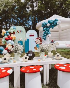 the table is set up with mickey mouse decorations