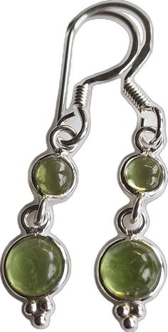 Peridot Dangle Earrings For May Birthstone, Green Long Drop Earrings As Gift, Green Long Drop Earrings For Gift, Green Sterling Silver Crystal Earrings, Green Long Drop Sterling Silver Jewelry, Green Gemstone Drop Crystal Earrings, Green Peridot Drop Earrings, Peridot Dangle Earrings With Ear Wire, Green Long Drop Jewelry For Gift