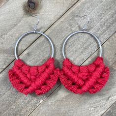 This pair of beautiful macrame earrings were hand knotted and fringed at the edges with a soft bright red colored cotton cord. These are surprisingly lightweight to wear and have nickel free antique silver earring wires. Each round shaped earring is 3 inches long and about 3 inches wide.  Made with love in a smoke-free home! If you have a sensitivity to certain types of metal, make sure to check each listing to see what types of earring wires were used.  Be sure to check out the rest of my micro-macrame jewelry in the shop! Earrings https://www.etsy.com/shop/HKMacrameJewelry?ref=hdr_shop_menu§ion_id=19344454 Bracelets https://www.etsy.com/shop/HKMacrameJewelry?ref=hdr_shop_menu§ion_id=8158880 Cuff Bracelets https://www.etsy.com/shop/HKMacrameJewelry?ref=hdr_shop_menu§ion_id=19122959 Hemp J Red Bohemian Macrame Jewelry, Red Bohemian Small Hoop Earrings, Bohemian Red Small Hoop Earrings, Adjustable Red Hoop Earrings, Red Bohemian Adjustable Hoop Earrings, Red Adjustable Bohemian Hoop Earrings, Adjustable Red Bohemian Hoop Earrings, Types Of Earring, Fringe Hoop Earrings