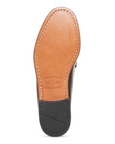 These classic penny loafers are perfect for any casual Instagram outfit. Featuring a round moc-stitch toe and penny strap accents, they have a vintage-inspired aesthetic that looks great in any snap. Made from premium leather that will age beautifully over time, they are comfortable enough for all-day wear yet polished enough for any social media shot. True to size for easy ordering, slip these loafers on and instantly elevate your look. Slip-on Leather Moc Toe Oxfords With Leather Footbed, Slip-on Moc Toe Oxfords With Leather Footbed, Business Moccasins With Leather Footbed And Moc Toe, Masculine Wingtip Moccasins With Leather Sole, Slip-on Moc Toe Dress Shoes With Leather Sole, Goodyear Welted Monk Strap Shoes With Moc Toe, Goodyear Welted Slip-on Moc Toe Leather Shoes, Masculine Slip-on Oxfords With Rubber Sole, Leather Lined Moc Toe Oxfords