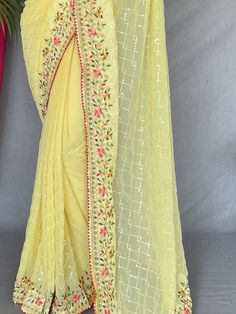 This exquisite saree is perfect for all your festive and celebratory occasions, adding a touch of traditional charm to your ensemble. The rich yellow georgette fabric is beautifully adorned with sequin and embroidered work, making it a head-turning piece that will surely make you stand out in the crowd.
Whether you're attending a wedding, a festival, or any special event, this saree will ensure that you look effortlessly elegant and stylish. The 5.50 meters of saree material gives you ample room Haldi Wear, Saree Material, Engagement Gown, Lehenga Crop Top, Lehenga Choli Wedding, Floral Lehenga, Party Wear Lehenga Choli, Reception Gown, Bollywood Lehenga