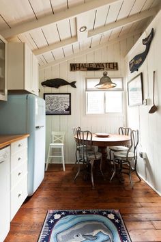 a kitchen with an area rug on the floor