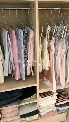 an organized closet with clothes hanging on racks