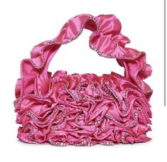 Add some flair to your outfit with this beautiful Betsey Johnson Frill Of It All shoulder bag. This stunning bag features a glossy frill pattern with rhinestone accents and a pink exterior color. The top handle is pink and made of polyester while the hardware is silver and made of stone material. The bag has a rectangle shape with a magnetic closure and is perfect for a wedding or party occasion. The bag dimensions are 10 inches in width, 7 inches in height, and 3 inches in depth, making it a small-sized shoulder bag. The interior lining is made of pink nylon and the bag is part of the Frill product line. Glamorous Pink Shoulder Bag For Formal Occasions, Glamorous Pink Shoulder Bag For Evening, Glamorous Pink Evening Shoulder Bag, Chic Pink Rhinestone Shoulder Bag, Formal Pink Shoulder Bag With Rhinestones, Frill Pattern, Betsey Johnson Clothes, Shoulder Bag Pink, Betsey Johnson Purses