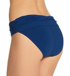 Cute swim bottom sits lower on your hips and has a stylish sarong-style band at the waist. Covered elastic around top edge of waist creates an instant fit. Foldover waistband overlaps at front, with ruched side seams that are sewn in place. Center back seam gives rear a more defined fit. Leg openings have covered elastic to hold fit in place. Mid-rise. Moderate, cheeky rear coverage. Bleu Rod Beattie fabric care tags on inner left side. Front is lined with pique knit, with no additional lining a Beachwear Tie-side Bottoms For Swimming, Beachwear Bottoms With Tie-side For Swimming, Blue Swimwear For Pool, Blue Swim Skirt For Swimming, Blue Elastane Swimwear For Poolside, Blue Ruched Swimwear In Elastane, Ruched Tie-side Bottoms For Poolside, Blue Ruched Stretch Swimwear, Blue Elastane Tankini For Swimming