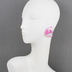 These stunning Anne and Frank Vigneri Lucite clip-on earrings feature a dimensional curved geometric design. The earrings are built with multilayer Lucite, a white background topped with bubblegum pink Lucite with embedded silver foil inclusions. There is no visible signature, although the very specific French clip-back is an unmistakable brand signature. Anne & Frank Vigneri made gorgeous, over-the-top lucite jewelry from 1982 to 1994. Their designs were bold and inventive and so original they Lucite Earrings, Modern Pink Jewelry For Party, Modern Pink Party Jewelry, Modern White Clip-on Earrings, Handmade Pink Clip-on Earrings For Party, Lucite Jewelry Beads, Modern Lucite Earrings, Luxury Modern Lucite Jewelry, Pink Geometric Earrings