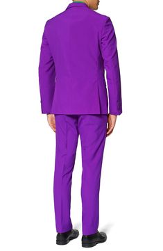 Watch your friends grimace and turn green with envy when you stride into the room sporting a regal purple suit featuring a slim, two-button jacket, sharply creased flat-front trousers and a matching to tie that pulls the whole look together. Jacket has a two-button closure, notch lapels; nonfunctional four-button cuffs; chest pocket; front flap pockets; side vents. Trousers have a zip fly with button-tab closure; front slant pockets; back welt pockets. Fully lined. 100% polyester. Dry clean or m Tailored Purple Suit For Party, Tailored Purple Party Suit, Tailored Purple Set For Party, Tailored Purple Party Sets, Purple Notch Lapel Suit For Party, Business Sets With Notch Lapel In Purple, Purple Business Sets With Notch Lapel, Tailored Purple Suit With Notch Lapel, Purple Tailored Suit With Notch Lapel