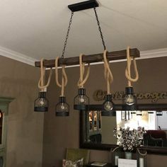 a chandelier hanging from the ceiling in a dining room