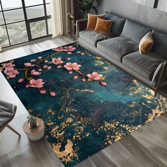 a living room area with a couch, chair and rug on the floor that has flowers painted on it