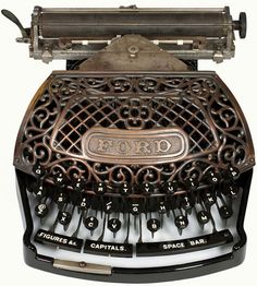 an old fashioned typewriter sitting on top of a white surface with the word ford printed on it