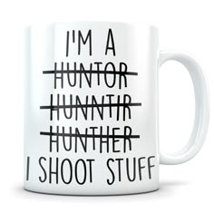 a white coffee mug with black writing that says i'm a hunter hunter, i shoot stuff