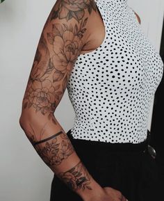 a woman with a tattoo on her arm