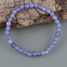 Gemstone : TanzaniteTreatment : NaturalStone size : 5 MM Finish/Shape : Smooth RoundQuality : AAASilver Weight In Carat : 0.60 CtBracelet Carat Weight :40 CaratStretchable braceletLength : We have multiple sizes. Please select the bracelet size at checkoutWe have used 925 sterling silver balls in the bracelet.*Free Mystery Gift With Every Purchase.Happy Shopping Amethyst 8mm Beads Jewelry Gift, Sapphire Jewelry With 8mm Beads, Healing Crystal Bracelet With Birthstone And Round Beads, Healing Crystal Bracelet With Birthstone, Round Crystal Bead Bracelet As Gift, Crystal Bracelet With Round Beads As Gift, Adjustable Amethyst Beaded Bracelets With Birthstone, Amethyst Beaded Bracelets With Round Beads, Beaded Amethyst Gemstones For Gifts