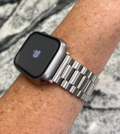 Fits the Apple Watch 44mm and 45mm only. Please look at the back of your watch for the correct millimeter size. The 49 ultra version is available in my shop. Mens or ladies band. Upgrade your Apple Watch with this titanium colored stainless steel band and or titanium color watch case made of poly carbonate with built-in screen protector. This is available to purchase just the watch band or the watch band and protector case.Please click on the options for your selection.  The band is 22mm wide with a 20 mm clasp.  It will fit a wrist from size 5.5 inches at the smallest up to size 8.5 And comes with a sizing tool. It does comes with a band shortening device to remove links to adjust to your wrist size.  ALL RIGHTS RESERVED TO MY IDEAS AND DESIGNS Ships with tracking numbers  The Apple Watch Modern Silver Apple Watch Band For Everyday Use, Silver Rectangular Apple Watch Band For Everyday Use, Silver Apple Watch Band For Everyday Use, Modern Silver Watch Accessories For Everyday, Apple Watch Stainless Steel, Bracelet Apple Watch, Stainless Steel Band, Apple Watch Band, Watch Case