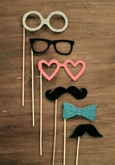 three mustaches, glasses and bow tie on sticks