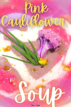 pink cauliflower soup with sour cream and chives