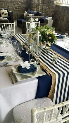 the table is set with blue and white linens