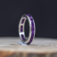 2.5 MM Full Eternity Stackable Stacking Square Simulated Purple Amethyst Band Ring, Silver Band Ring, Wedding Band Ring, Valentine's Day gift, Feather Gemstone Ring, Color Gemstone Rings, Valentine's Day Gift, Vintage Ring, Anniversary Ring, Personalize gift, Proposal Ring, Engagement Ring, Wedding Ring, ❤ Item Details: Metal: Sterling Silver Metal Purity: 925 Setting: Channel Setting Center Stone: Amethyst Center Stone Shape: Square Stone Weight: 2.42 Carat Gross Weight: 3.340 Gram Stone Size: Purple Amethyst Stackable Wedding Rings, Anniversary Amethyst Halo Jewelry, Amethyst Halo Jewelry For Anniversary, Halo Amethyst Jewelry For Anniversary, Purple Birthstone Stackable Rings For Wedding, Stackable Amethyst Jewelry For Anniversary, Gift Amethyst Halo Ring, Amethyst Stackable Wedding Rings, Stackable Amethyst Birthstone Ring For Anniversary