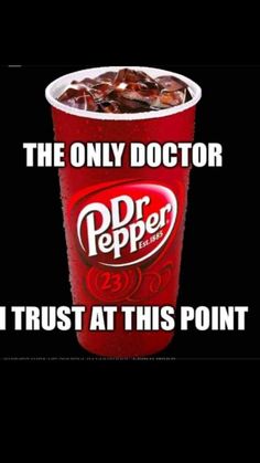 a red cup filled with ice cream next to a sign that says, the only doctor i trust at this point