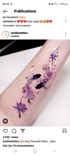 a tattoo with purple flowers on the arm