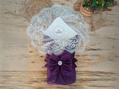 an arrangement of lace and ribbons on a wooden table