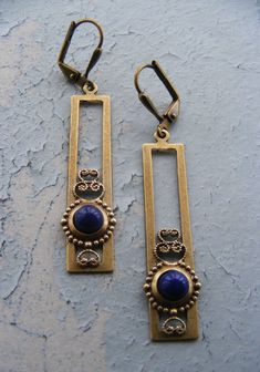 VINTAGE ELEMENTS Unique Jewellery, Handmade from Vintage Inspired , Original designs Striking Art Nouveau style, long, rectangular, Brass Filigree Earrings, inspired by Charles Rennie Mackintosh. Extremely light to wear. Ornate brass filigree settings feature Vintage Lapis Blue glass cabochons. These Earrings have brass leverback earwires and measure 5.5cm from the top of the earwires. Bijoux Art Nouveau, Three Necklaces, Copper Jewellery, Cabochon Earrings, Brass Filigree, Pearl Jewelry Design, Handmade Jewelry Bracelets, Vintage Elements, Lapis Blue