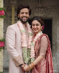 a man and woman standing next to each other