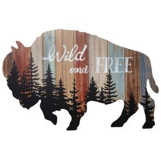 a wooden bison with the words wild and free painted on it's back side