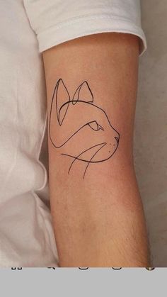 a tattoo on the arm of a man with a fox head in black and white