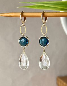 Elegant Earrings with Faceted Clear Crystal Pear Drops 17 x 12 mm Faceted Blue Sapphire Glass Stones in Gold Plated Bezel setting 12 x 12 mm Gold plated Lever back Round Ear clasp. The total length is 2.3 inches or 58 mm * *.* * * * * * * * * * * * * * * * * * * * * * * * * * * * Your order will be wrapped and shipped in jewelry gift box. Please enter my shop here - www.etsy.com/shop/ZarinaJewelry or my FB page - facebook.com/ZarinaJewelry Faceted Drop Earrings For Wedding, Teardrop Faceted Earrings For Wedding, Faceted Teardrop Earrings For Weddings, Wedding Teardrop Faceted Earrings, Blue Briolette Earrings For Wedding, White Faceted Earrings For Wedding, Briolette Faceted Wedding Earrings, Wedding Briolette Faceted Earrings, Wedding White Faceted Earrings