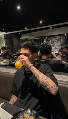 a man sitting at a table with food in front of him