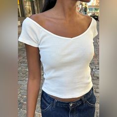 Ribbed Fitted Wide V-Neck Basic Short Sleeve Top. Fabrics: 100% Cotton Measurements: 22" (56cm) Length, 15" (38cm) Bust Made In: China Casual White Fitted V-neck Top, Fitted Short Sleeve V-neck Top For Day Out, Casual Fitted White V-neck Top, Fitted Casual V-neck Top For Day Out, Basic V-neck Crop Top For Spring, Spring Basic V-neck Crop Top, Brandy Melville Gina Top, Brandy Melville Sweatshirt, Top Fabrics