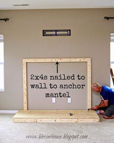 a man kneeling on the floor next to a sign that says, exas nailed to wall to another mantel