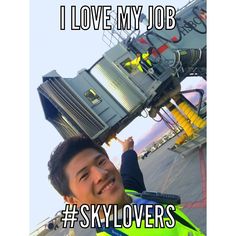 a man with his head in the air holding up a sign that says, i love my job skylovers