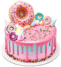 a birthday cake decorated with donuts and sprinkles